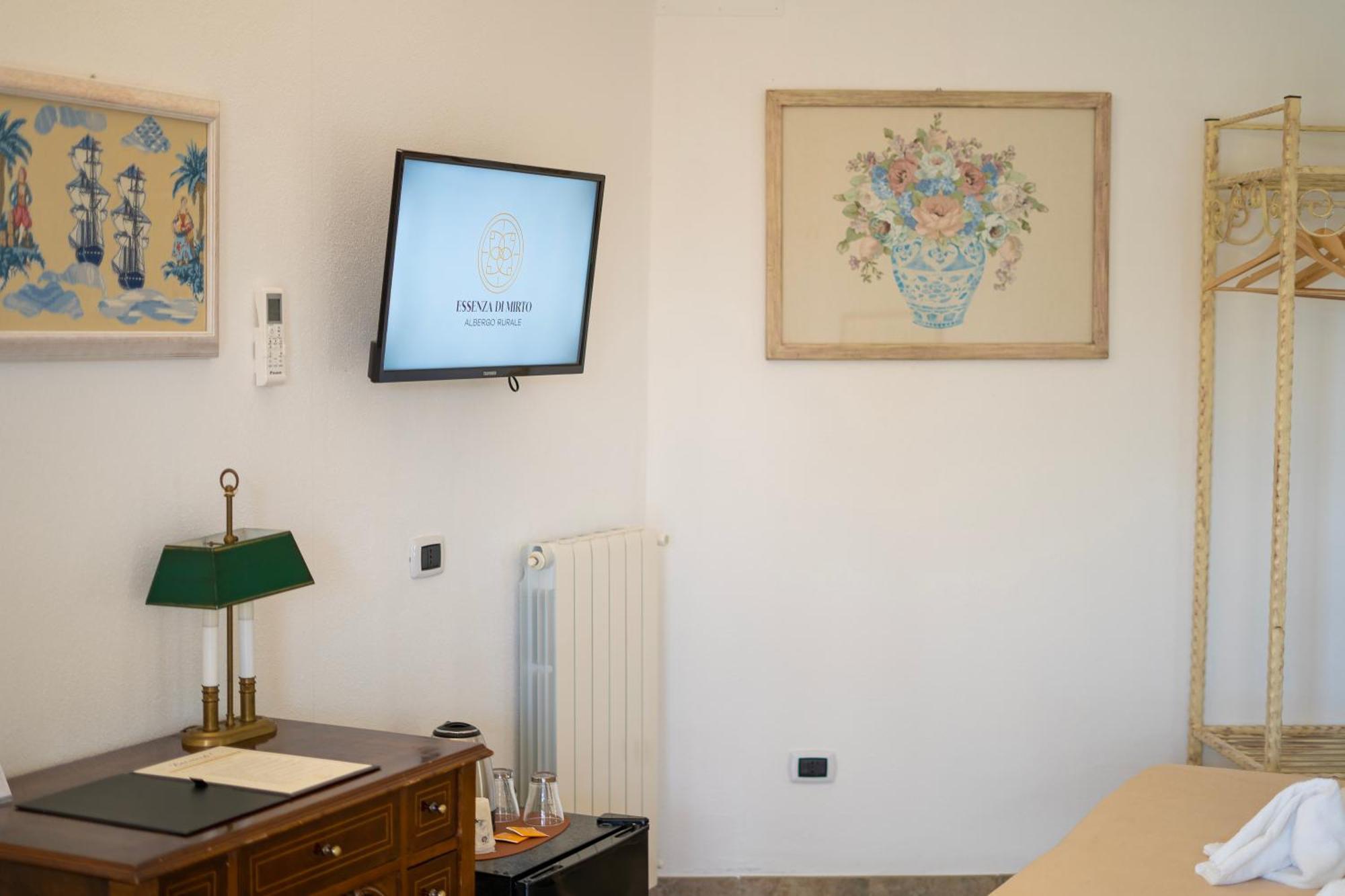 Hotel Essenza Di Mirto La Caletta Habitación foto